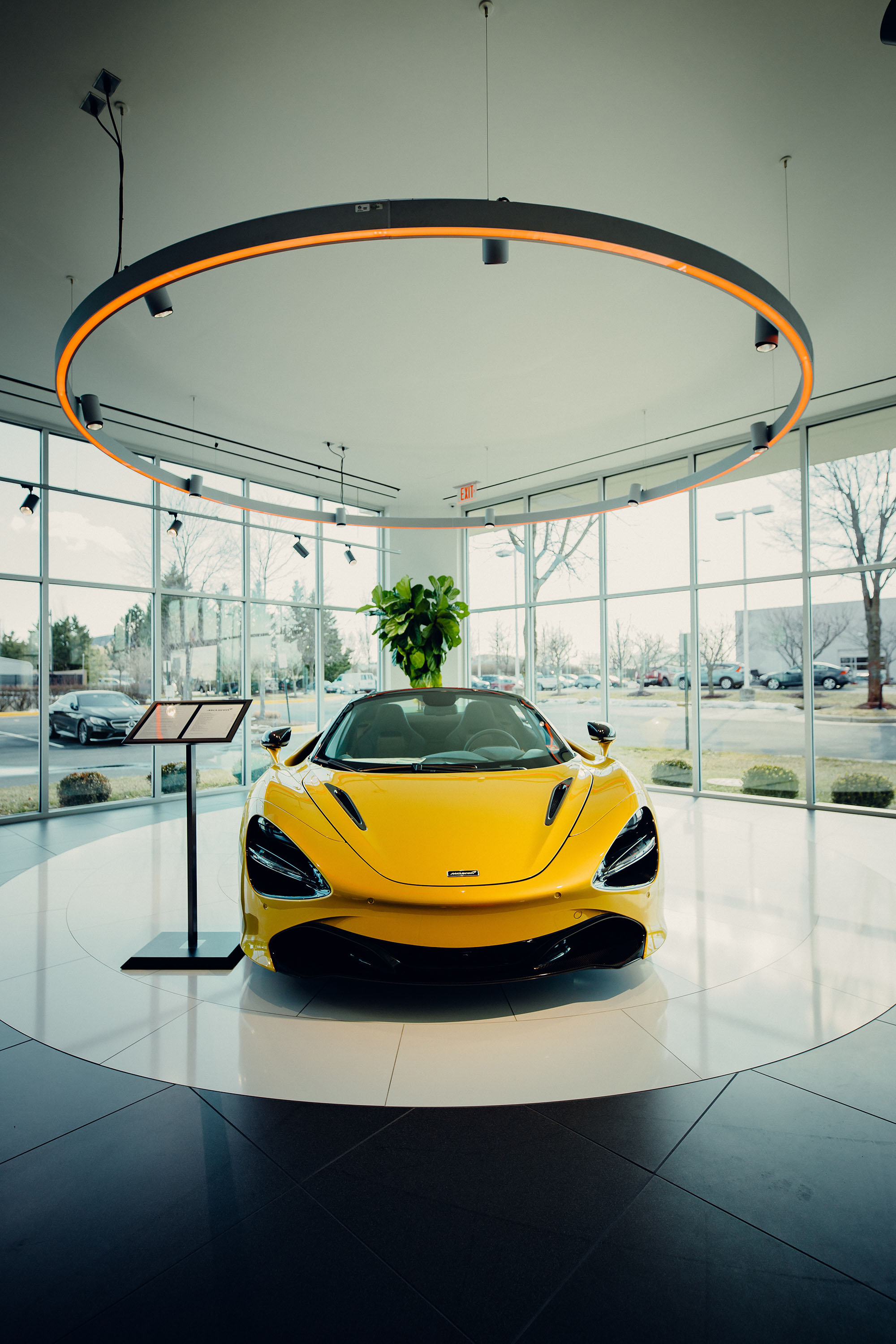 luxury sports car display in premium showroom