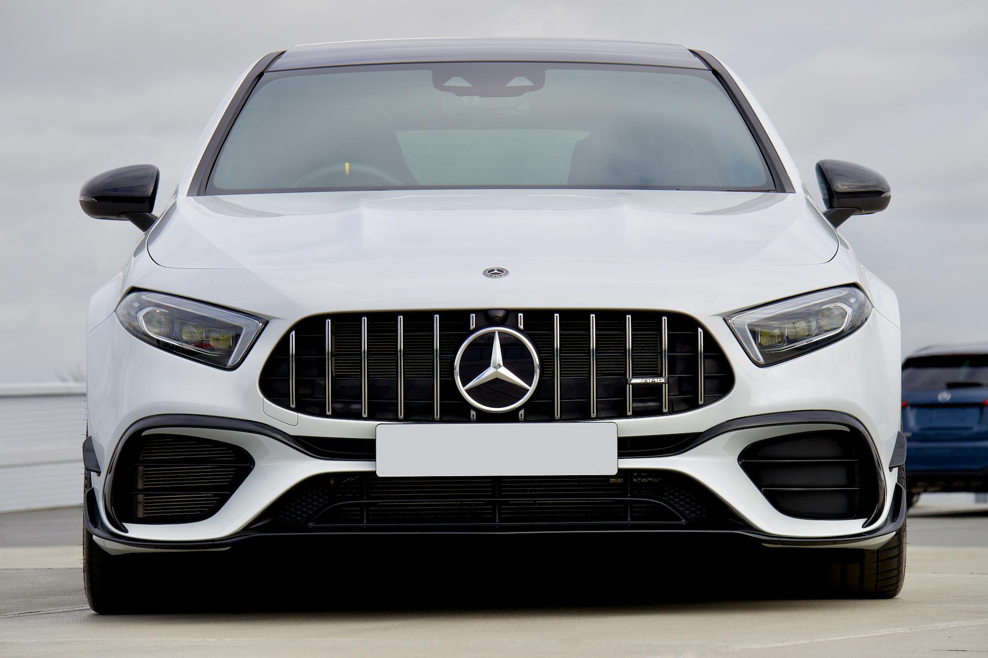 front view of white mercedes-benz amg hatchback