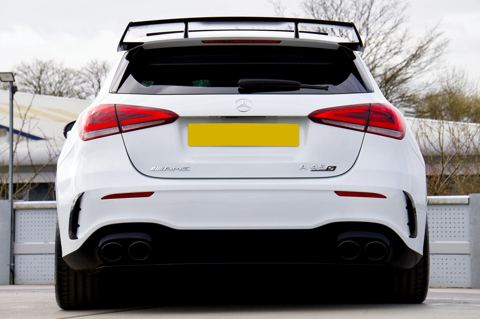 rear view of a white mercedes-benz amg a45 s hatchback