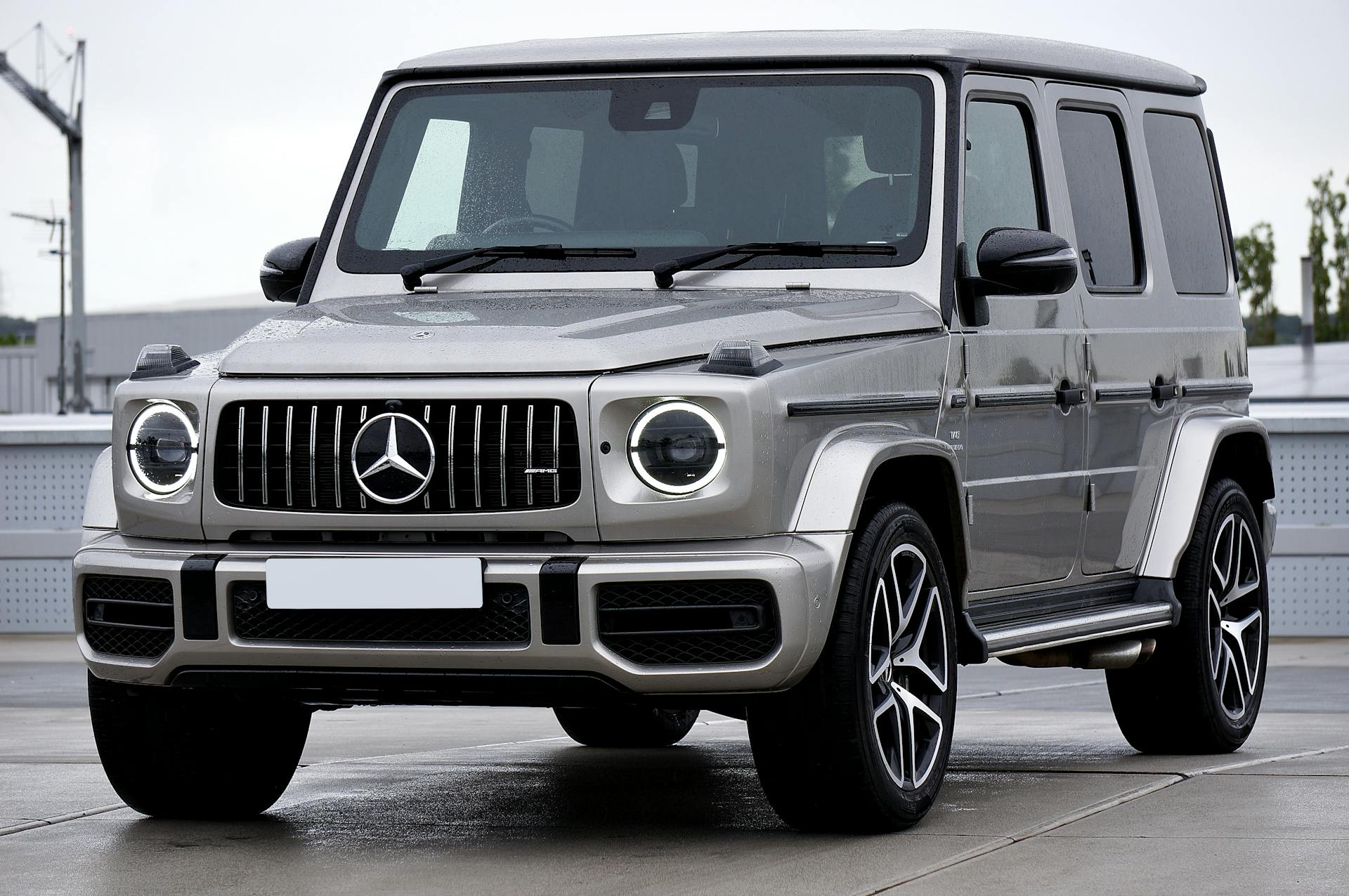 front view of a silver mercedes-benz g-class (amg g63) luxury suv