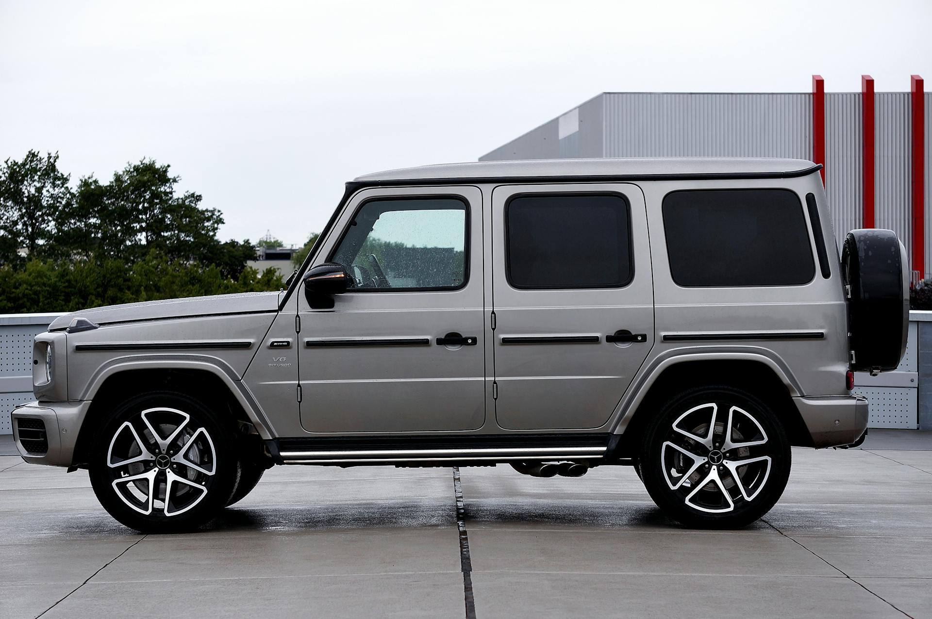 side view of a silver mercedes-benz g-class (amg g63) luxury suv