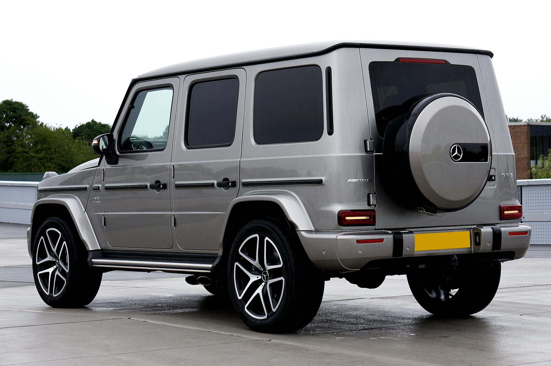 rear view of a silver mercedes-benz g-class (amg g63) luxury suv