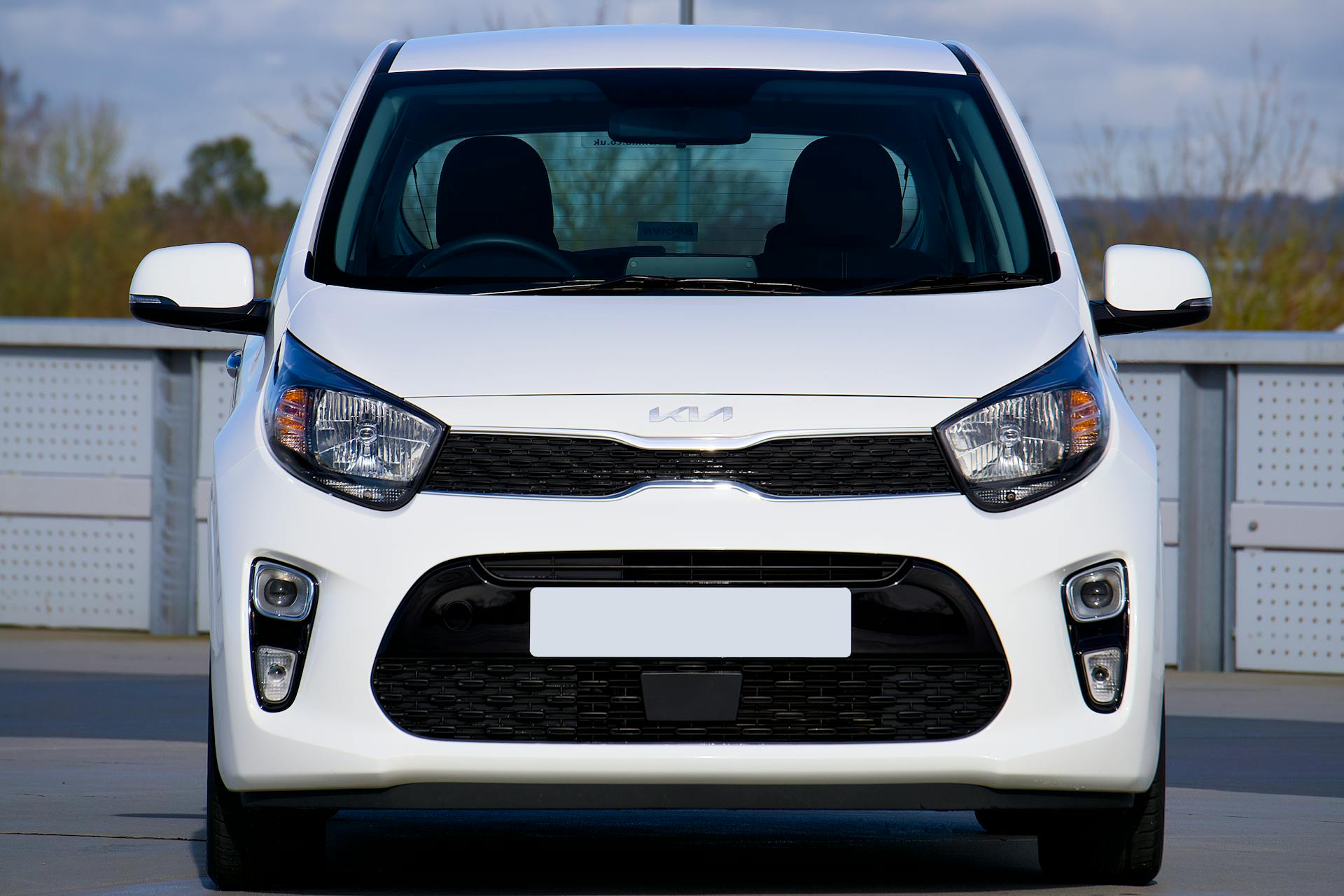 white kia hatchback front view