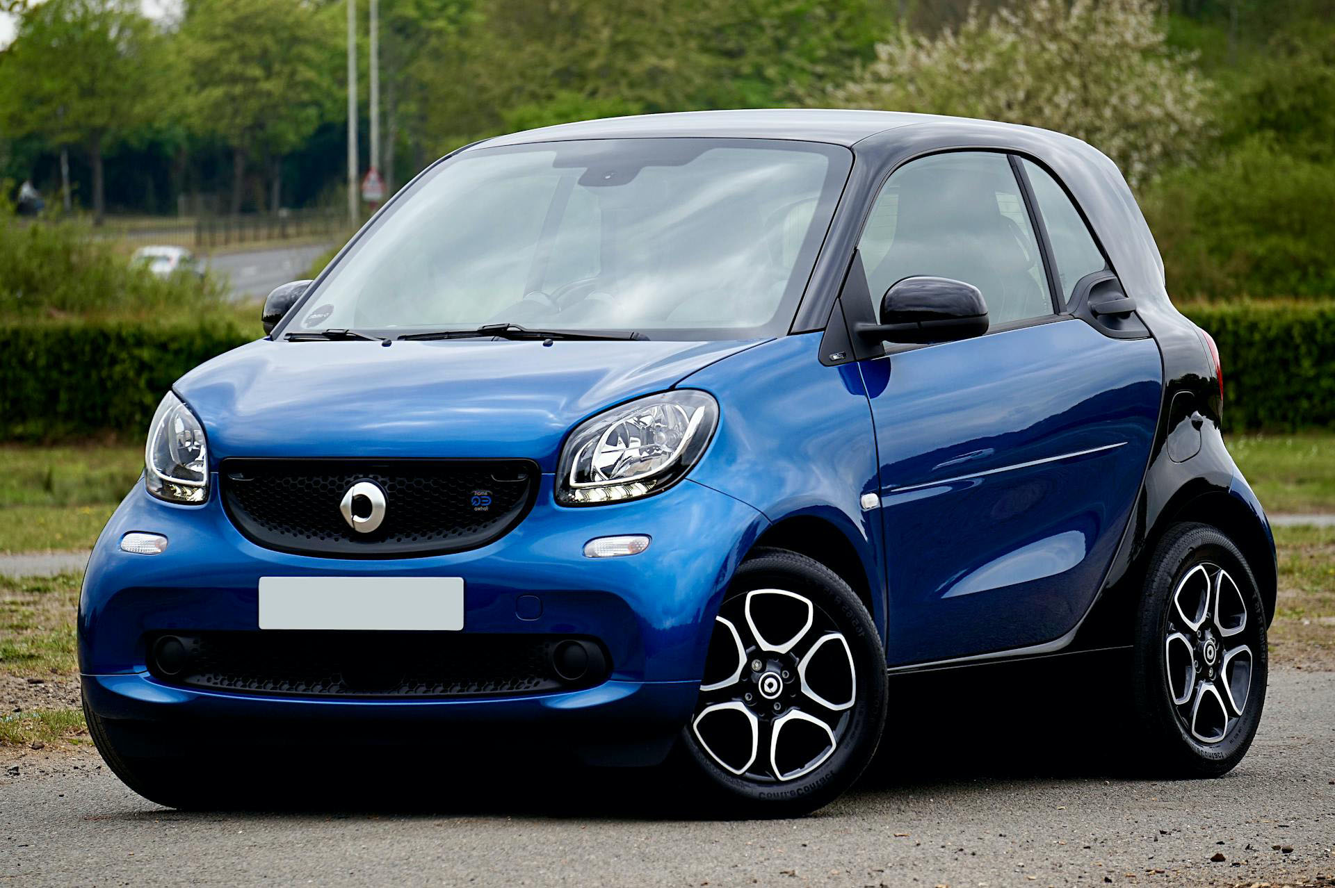 blue smart car compact coupe