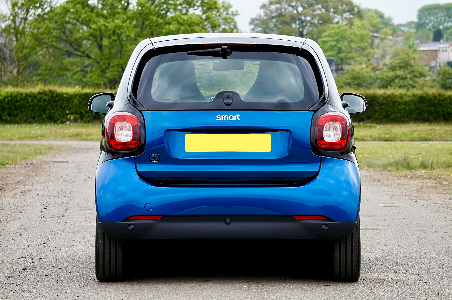 blue smart car rear view