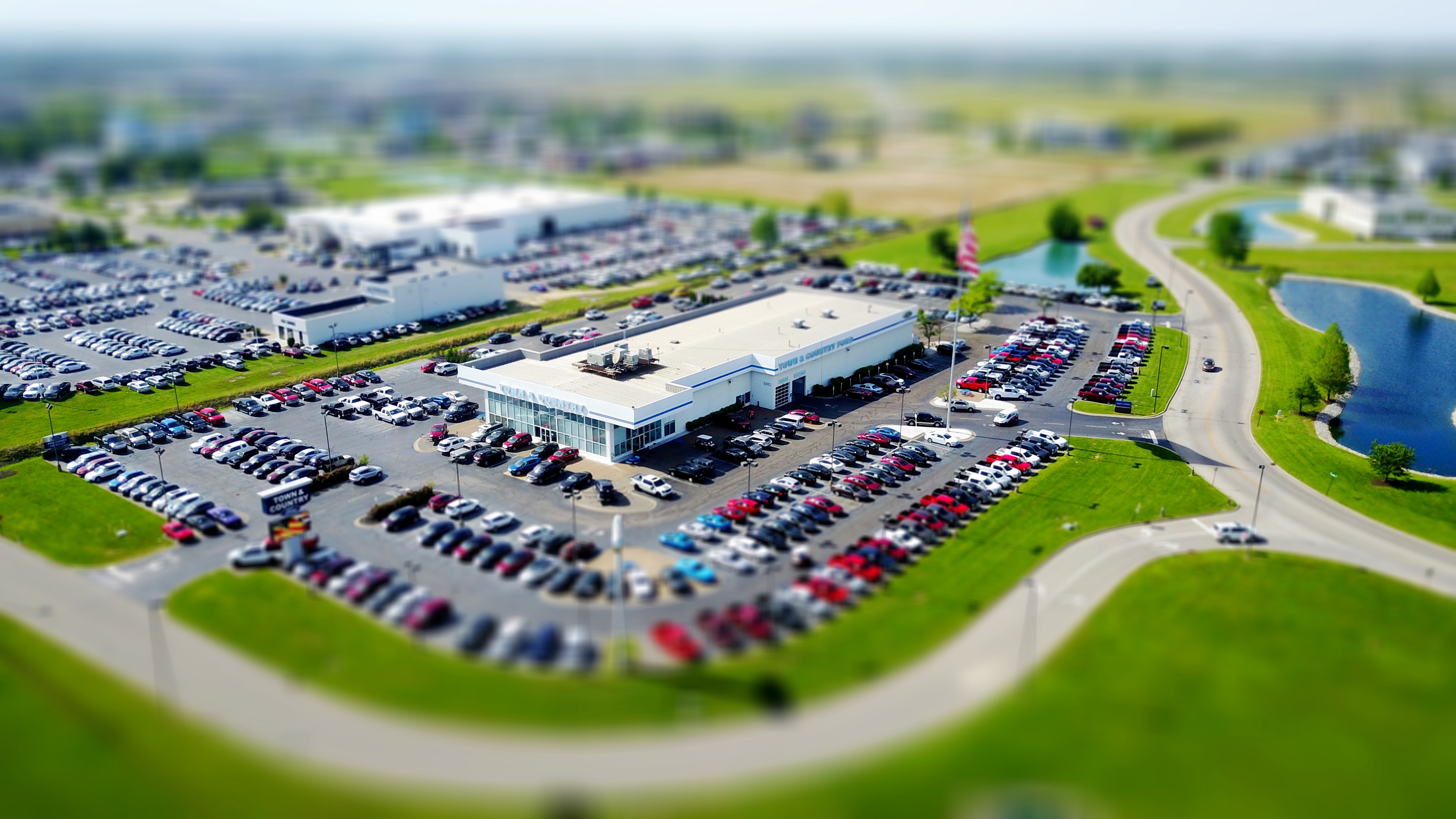large car dealership aerial view